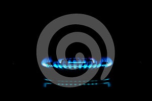 Isolated close up shot of Blue flames of gas stove in the kitchen