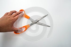 Isolated close up women hold scissors for cutting