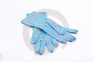 Isolated closeup of blue rubber gloves on a white background