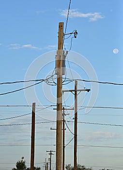 Isolated closeup of electric transformer on pole to signify the aging power grid