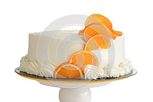 isolated closeup vanilla cake with orange slices