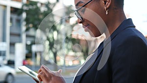 Isolated closeup of a young female chatting or typing a text message