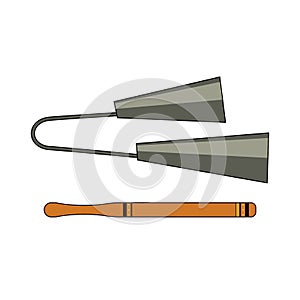 Isolated colorful decorative ornate metal agogo with stick on white background. Colored brazilian musical instrument for bateria o photo