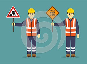 Isolated construction worker holding traffic or road sign. Road work ahead sign.