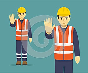 Isolated construction worker makes a stop gesture with his hand. Front view.