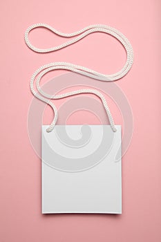 Isolated convention name badge on pink background, plastic tag id card mockup