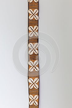 Isolated Cowrie shells leather belt from Nigeria