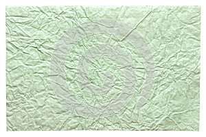 Isolated crumpled sheet paper in excellent light green color for design work.