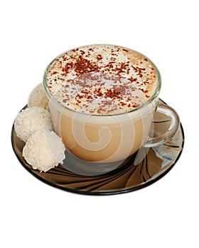 Isolated cup of capuccino and coconut candies
