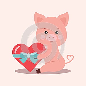 Isolated cute little romantic pink pig with gift in a shape of red heart tied with a blue ribbon