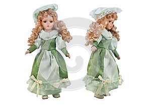 Isolated doll toy in green dress & hat.