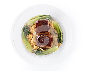 Isolated Dong Po Rou Dongpo pork meat in a beautiful plate with green vegetable photo