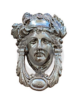 Isolated door knocker â€“ antique head on the entrance of a house on Malta. Italian traditional doorknob on white background . Old
