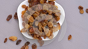 Isolated dried grapes. yellow is the highest grade on outdoor background.