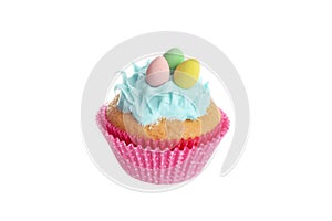 isolated easter cupcake with blue frosting and chocolate mini eggs