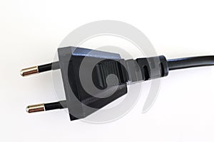 Isolated electrical black and white european plugs on a white background