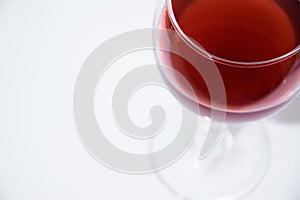 Isolated elegant glass of red wine on white background with space for menu or text