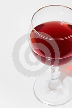 Isolated elegant glass of red wine on white background with space for menu or text