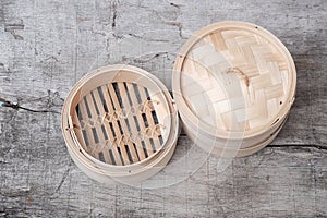 Isolated empty round steamer bamboo basket or crate