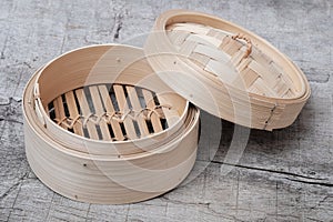 Isolated empty round steamer bamboo basket or crate