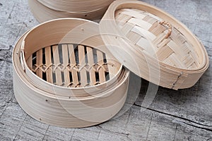 Isolated empty round steamer bamboo basket or crate