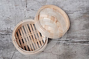 Isolated empty round steamer bamboo basket or crate