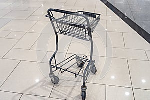 Isolated empty shopping cart in shopping mall
