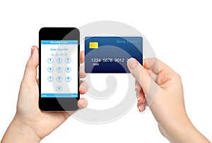 Isolated female hands holding phone and credit card and enter a