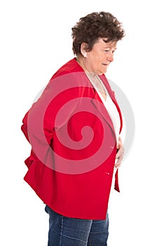 Isolated female senior in red has backache or rheumatism.