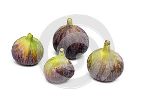 Isolated figs. One and a half fresh fig fruits isolated on white background