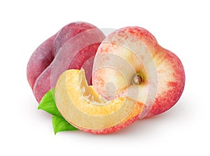 Isolated flat peaches. Two heart shaped flat peach fruit and a slice with leaves isolated on white background.