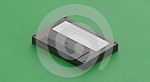 Floppy disk with label on green background, vintage storage medium