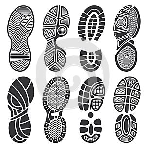 Isolated footprint vector silhouettes. Dirty shoes and sneakers footprints