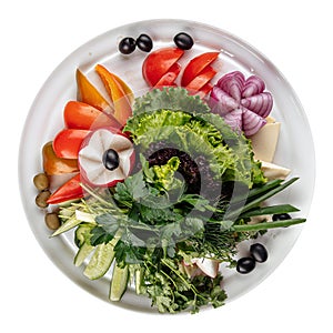 Isolated fresh vegetables platter with greens