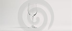 Isolated front view of an empty wine glass on white backdrop