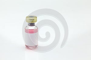 Isolated glass vaccine bottle with colored liquid very close high magnification mockup