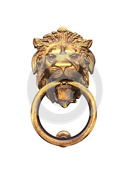 Isolated gold lion head, door knocker with the ring on its mouth on the entrance of a house, Malta. Italian traditional doorknob