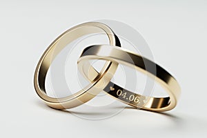 Isolated golden wedding rings with date 4. June
