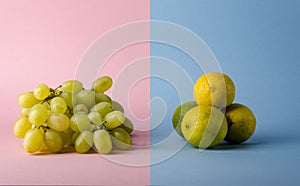 Isolated grapes and lemon concept over a creative modern background.