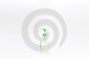 Isolated green alcohol gel bottle and pump on white background