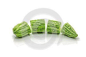 Isolated of green bitter gourd sliced on the white background