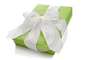Isolated green gift box tied with white ribbon for Christmas