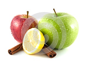 Isolated green and red apples, lemon with cinnamon