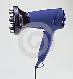 Isolated hair dryer on gray