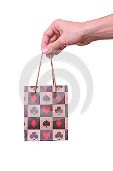 Isolated hand holding shopping paper bag