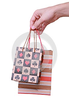 Isolated hand holding shopping paper bag