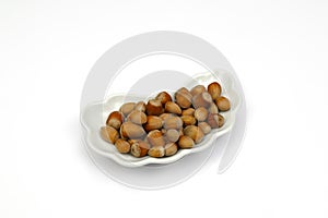 Isolated haselnuts on cap