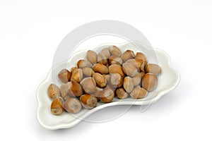 Isolated haselnuts on cap