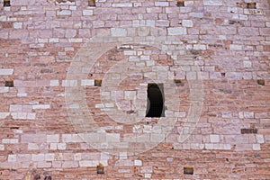 Isolated hole in the brick wall tower