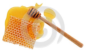 Isolated honey. Honeycomb beeswax with fresh liquid yellow honey and dipper spoon on white background